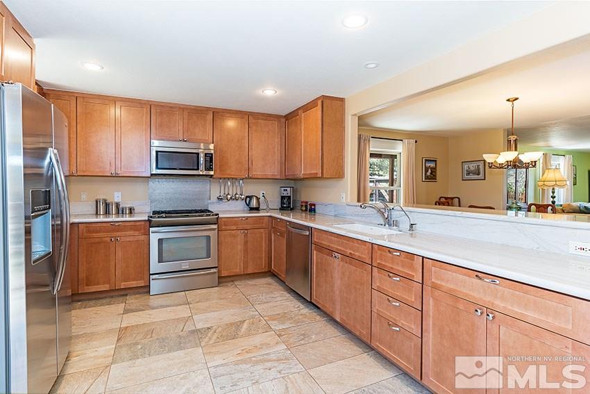 2141 Cartwright Road Reno, NV 89521 - Photo 8 of 23 a kitchen with stainless steel appliances and cabinets