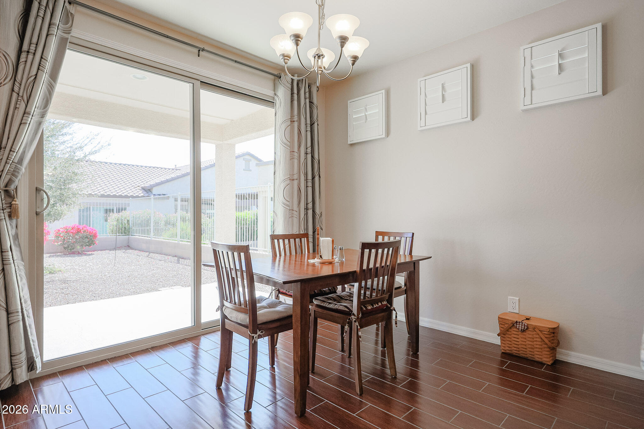 17545 West Fairview Street Goodyear, AZ 85338 - Photo 14 of 55 a view of a dining room with furniture window and wooden floor