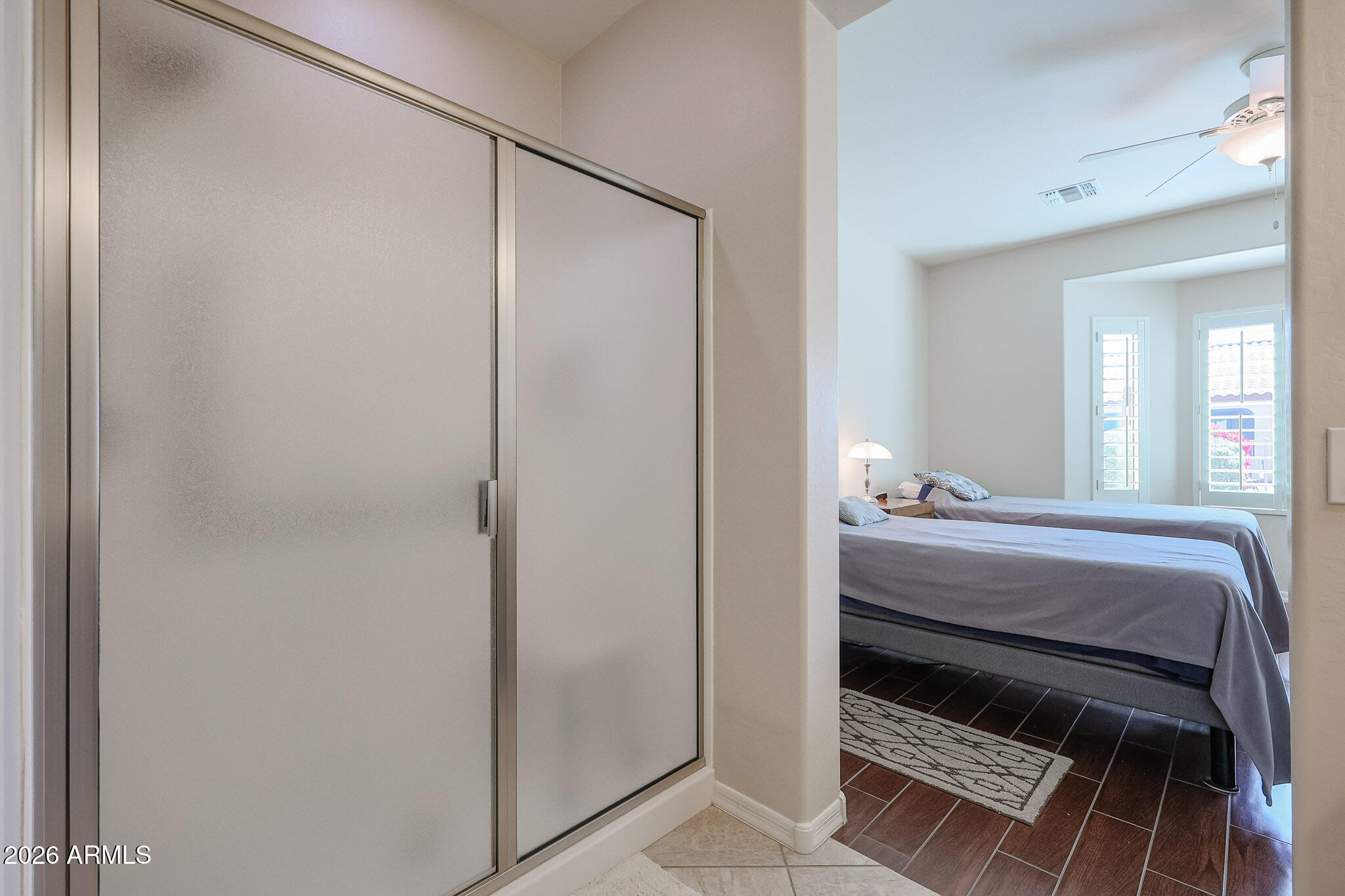 17545 West Fairview Street Goodyear, AZ 85338 - Photo 19 of 55 a room with a bed and a mirror