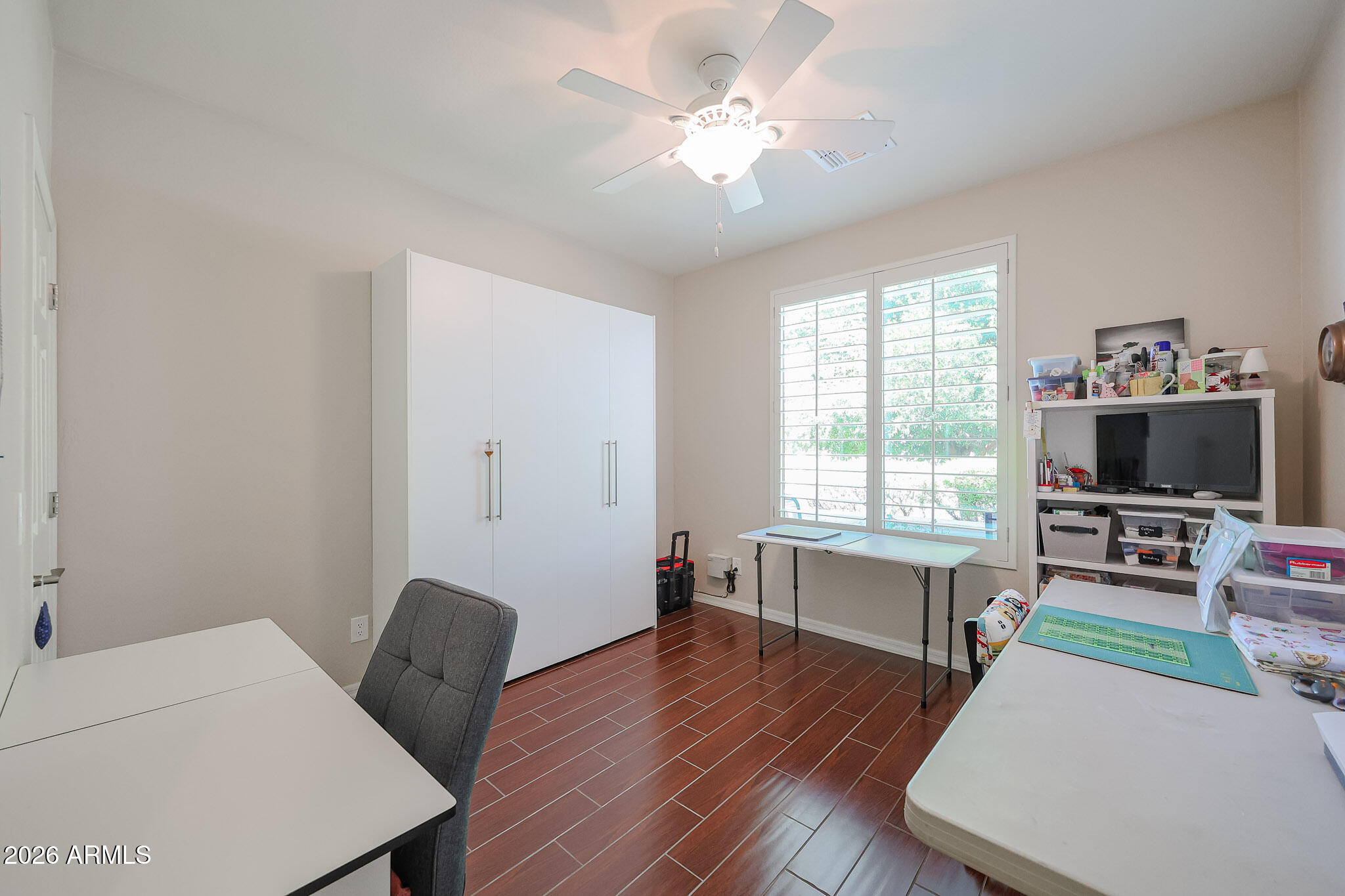 17545 West Fairview Street Goodyear, AZ 85338 - Photo 20 of 55 a living room with furniture and a flat screen tv