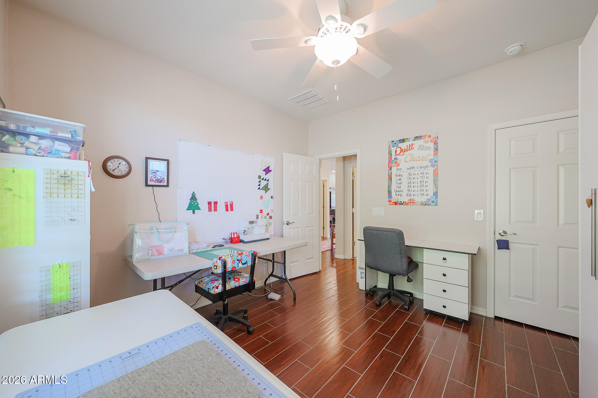 17545 West Fairview Street Goodyear, AZ 85338 - Photo 21 of 55 a living room with furniture and a wooden floor