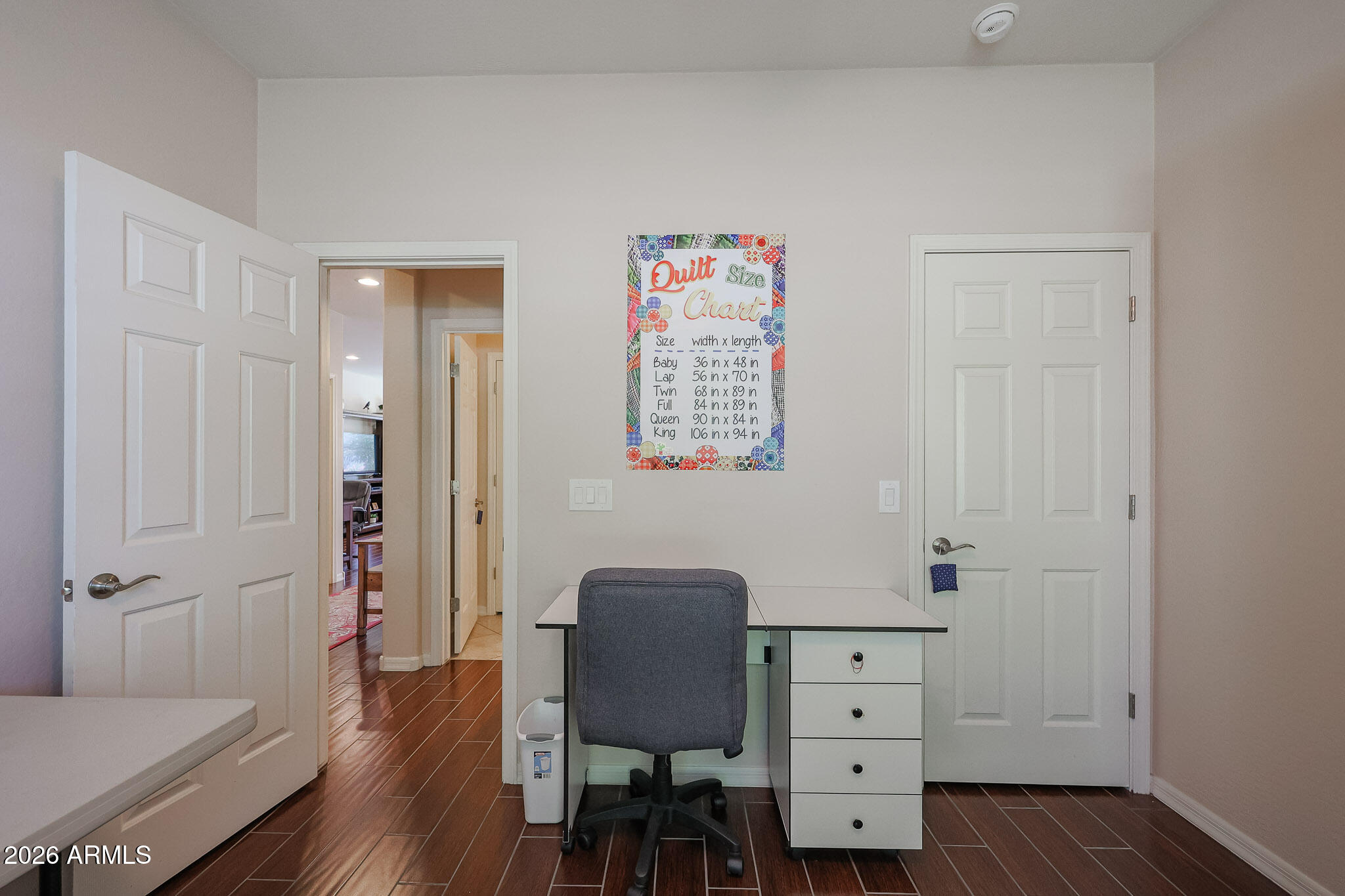 17545 West Fairview Street Goodyear, AZ 85338 - Photo 22 of 55 a view of a workspace with furniture and wooden floor