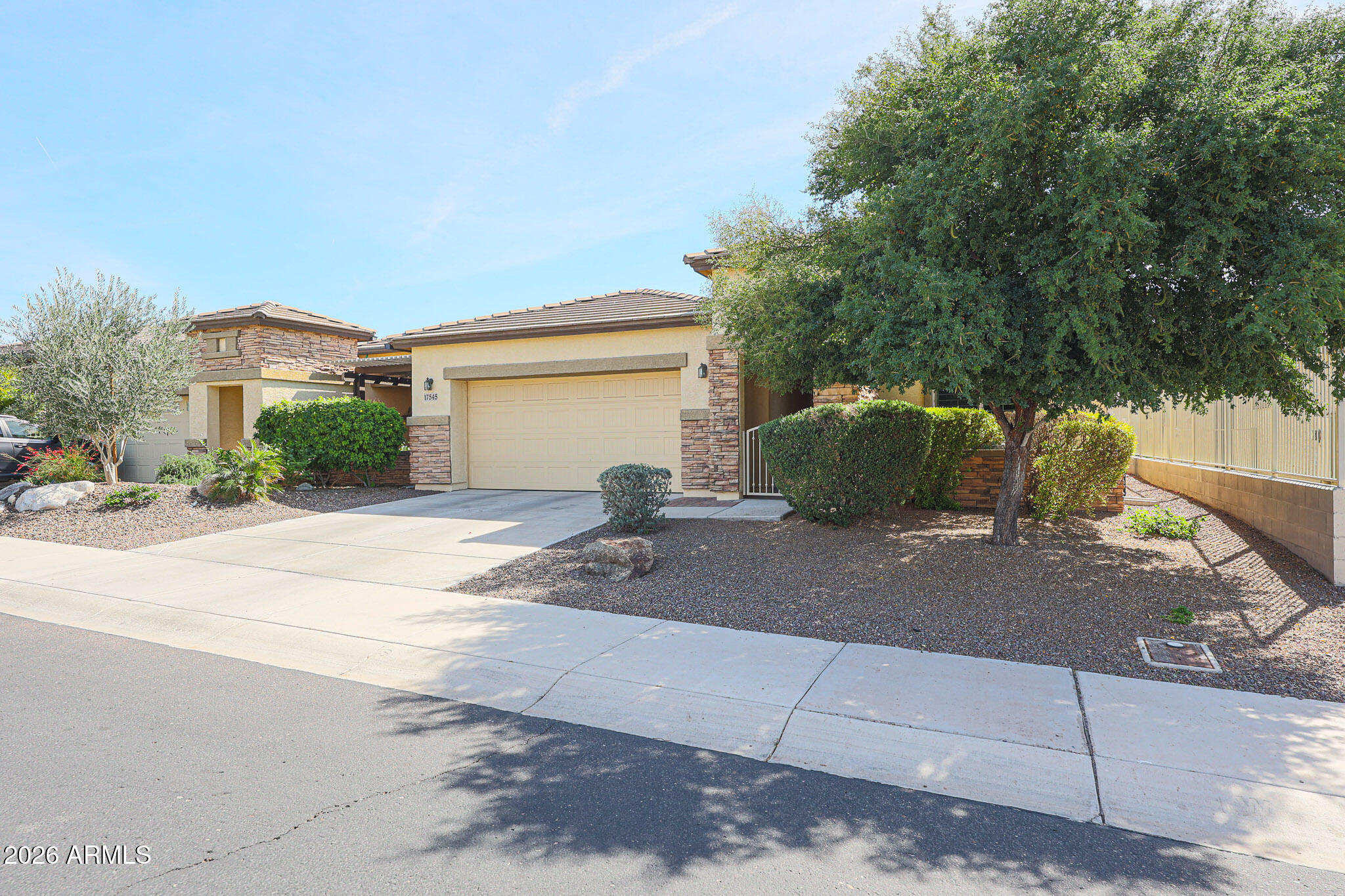 17545 West Fairview Street Goodyear, AZ 85338 - Photo 2 of 55 a view of a house with a yard and garage