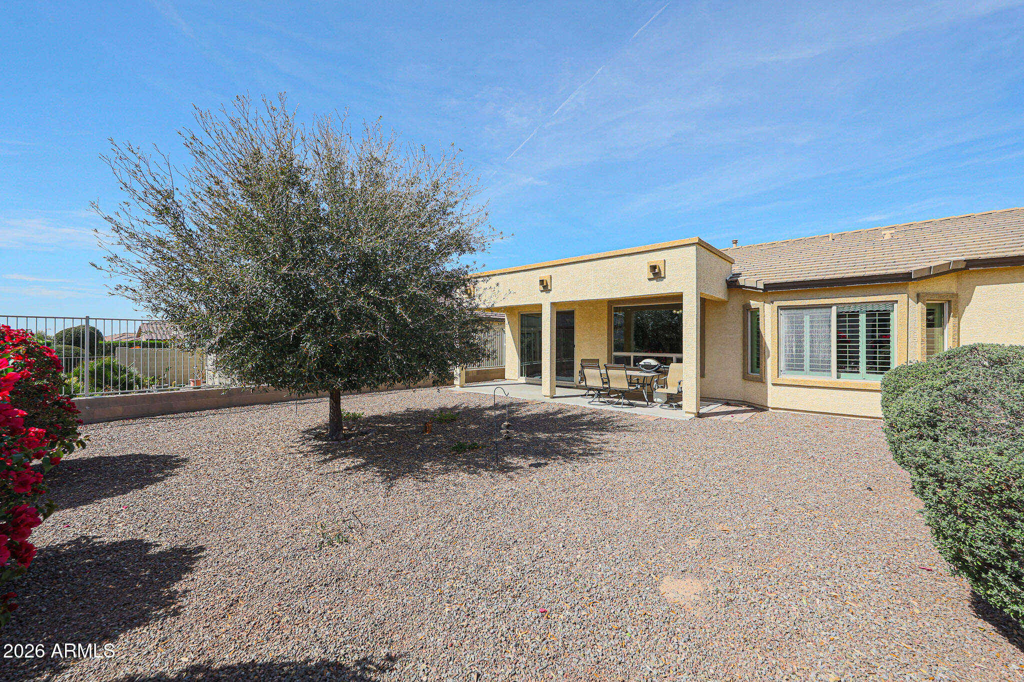 17545 West Fairview Street Goodyear, AZ 85338 - Photo 30 of 55 a view of a house with backyard and a tree