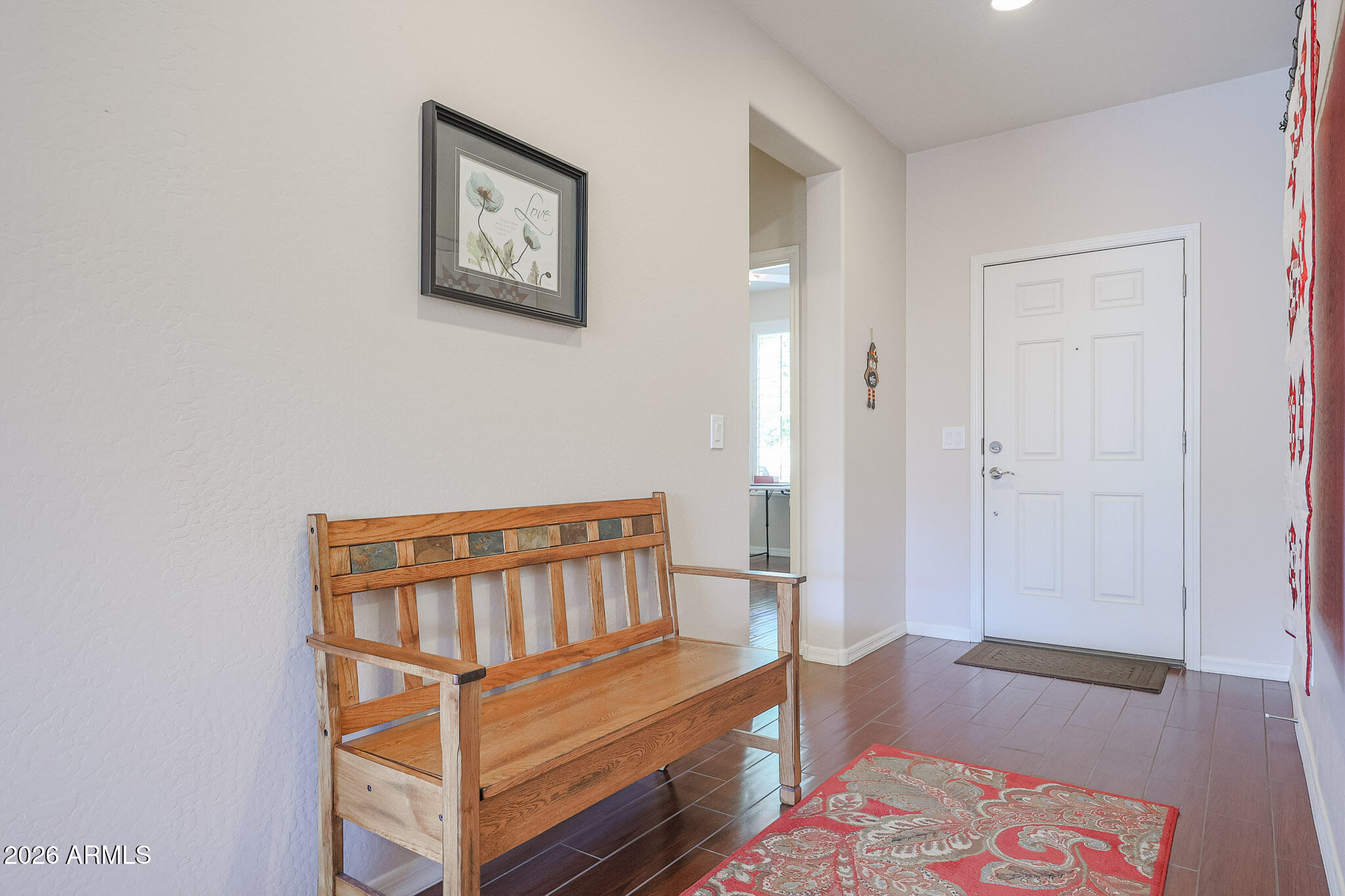 17545 West Fairview Street Goodyear, AZ 85338 - Photo 5 of 55 a bedroom with a bed and wooden floor