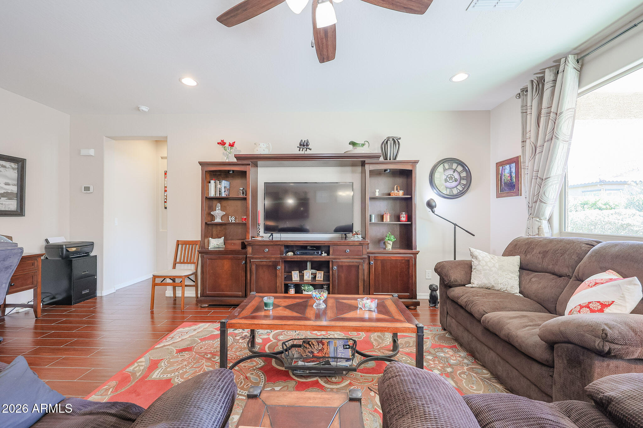 17545 West Fairview Street Goodyear, AZ 85338 - Photo 9 of 55 a living room with furniture and a large window
