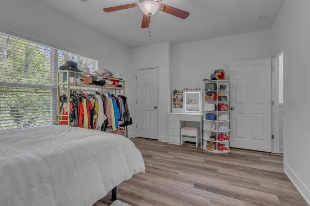 a bed room with a bed and a book shelf