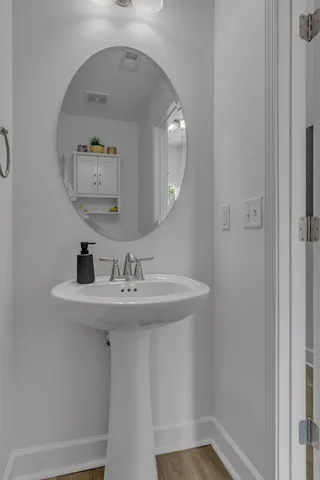 a bathroom with a sink and mirror