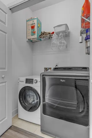 a utility room with dryer and washer