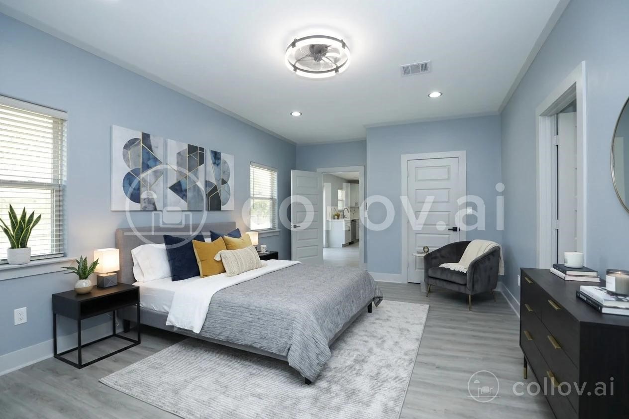 4047 Juliet Street Houston, TX 77087 - Photo 20 of 38 a bedroom with a bed and wooden floor