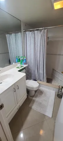 a spacious bathroom with a granite countertop sink and a mirror