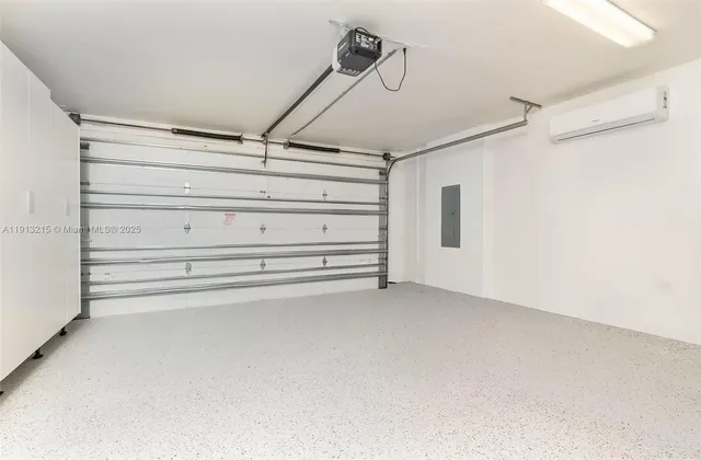 a bedroom with a large bed and a lamp