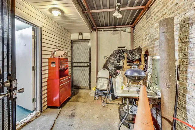 a living room with patio furniture and a wooden floor
