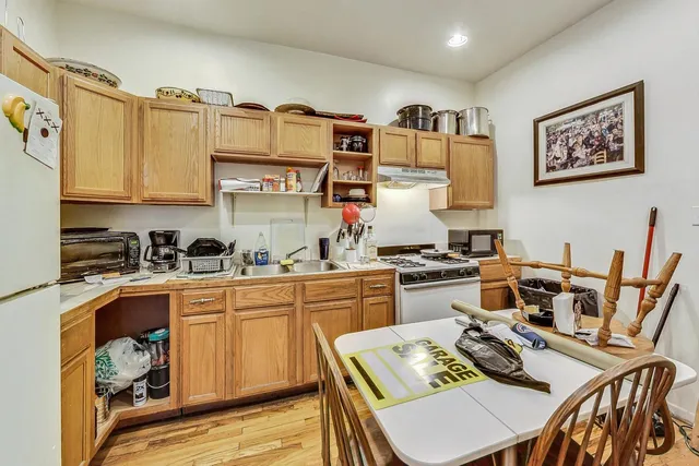 a bedroom with a bed and a table