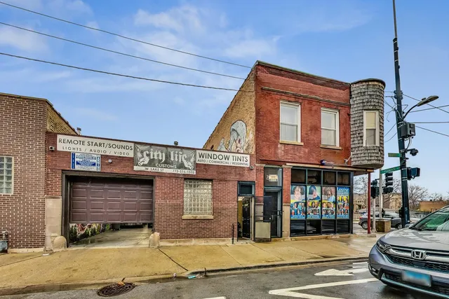 a front view of a house with parking area