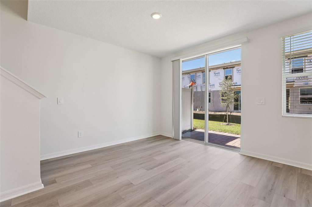 4264 Ranch House Road St. Cloud, FL 34772 - Photo 16 of 74 wooden floor in an empty room with a window