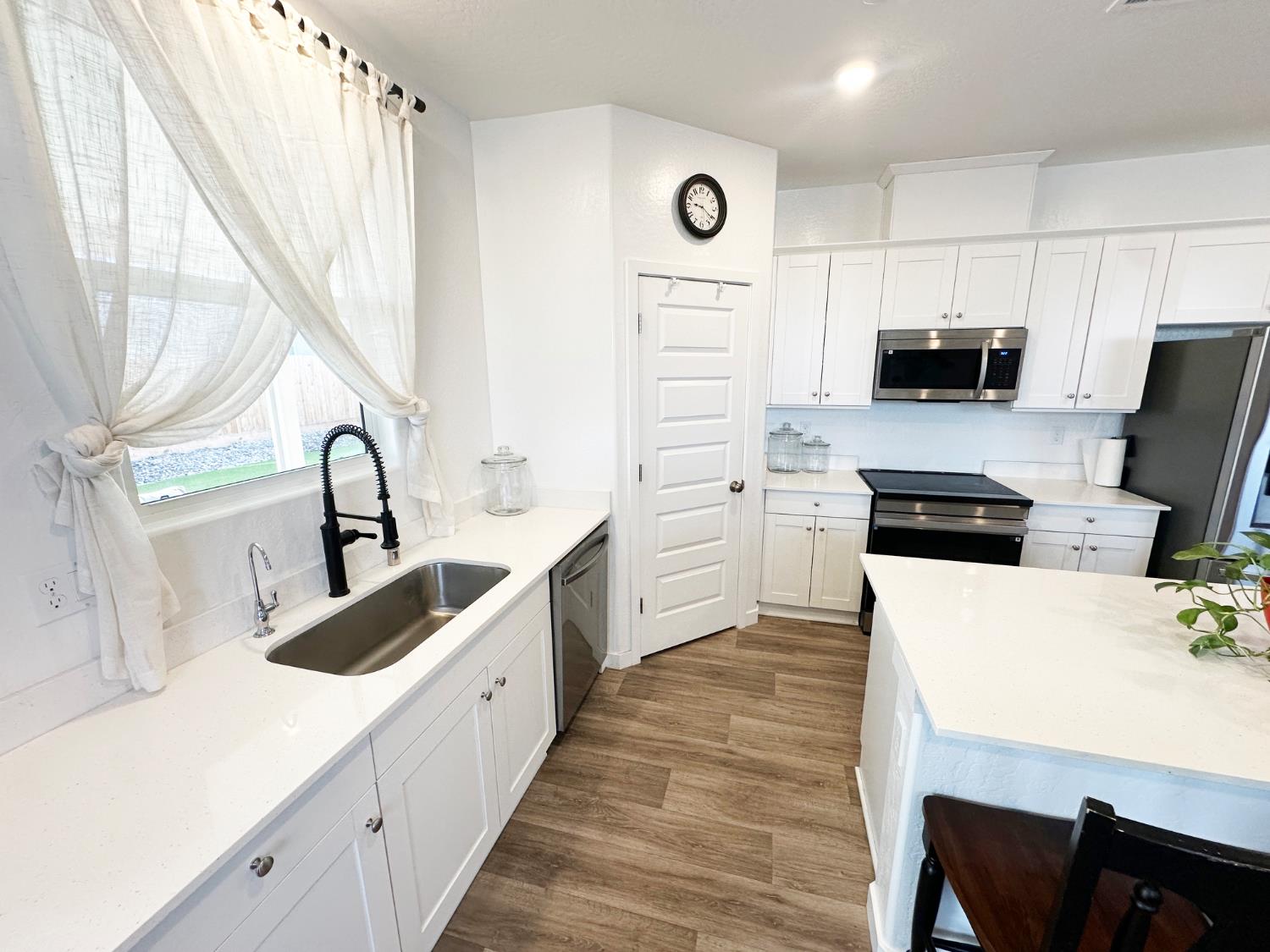 1757 Klamath Road South Madera, CA 93636 - Photo 1 of 33 a kitchen with granite countertop a sink and appliances