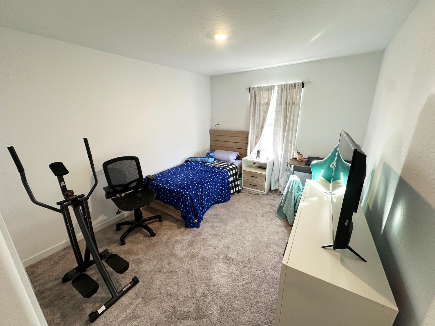 1757 Klamath Road South Madera, CA 93636 - Photo 27 of 34 a view of a room with gym equipment