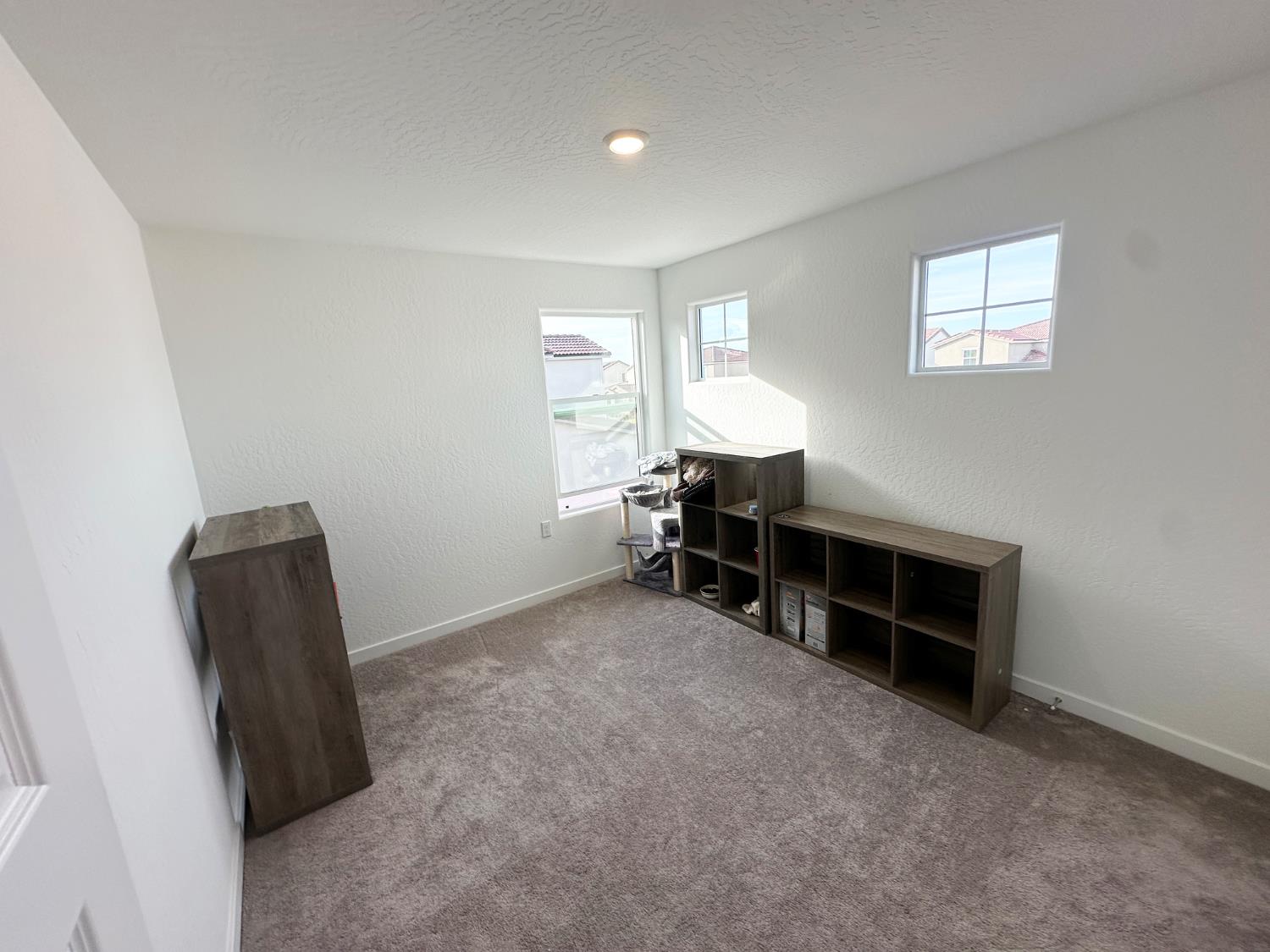 1757 Klamath Road South Madera, CA 93636 - Photo 28 of 34 an empty room with furniture and a window