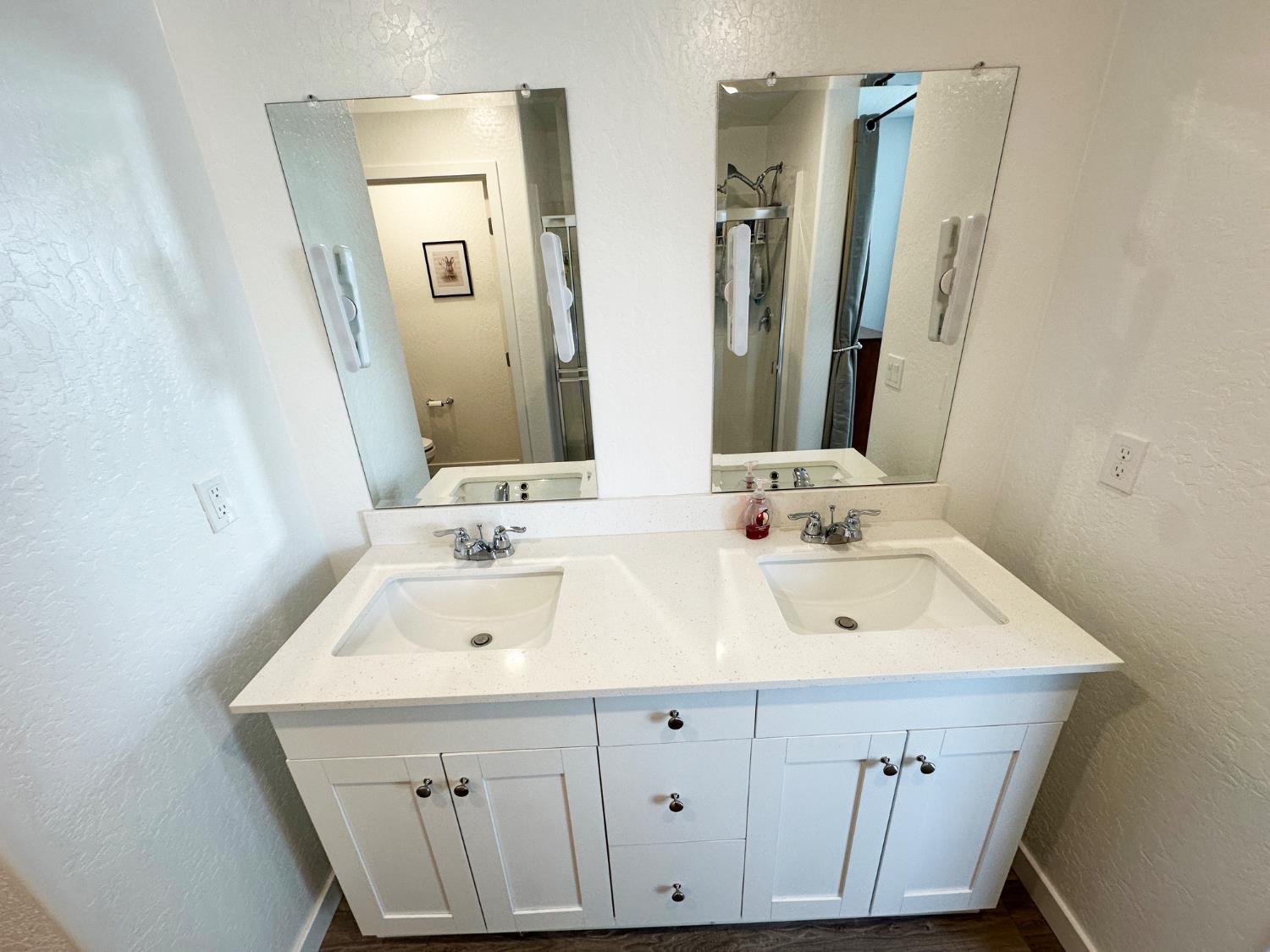 1757 Klamath Road South Madera, CA 93636 - Photo 29 of 34 a bathroom with a sink and a mirror