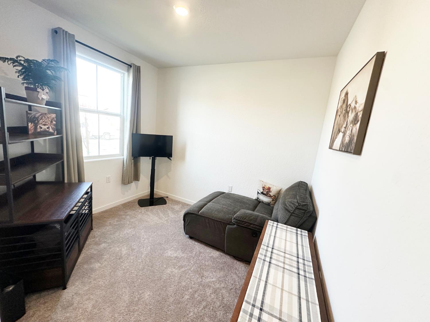 1757 Klamath Road South Madera, CA 93636 - Photo 32 of 34 a living room with furniture and a window