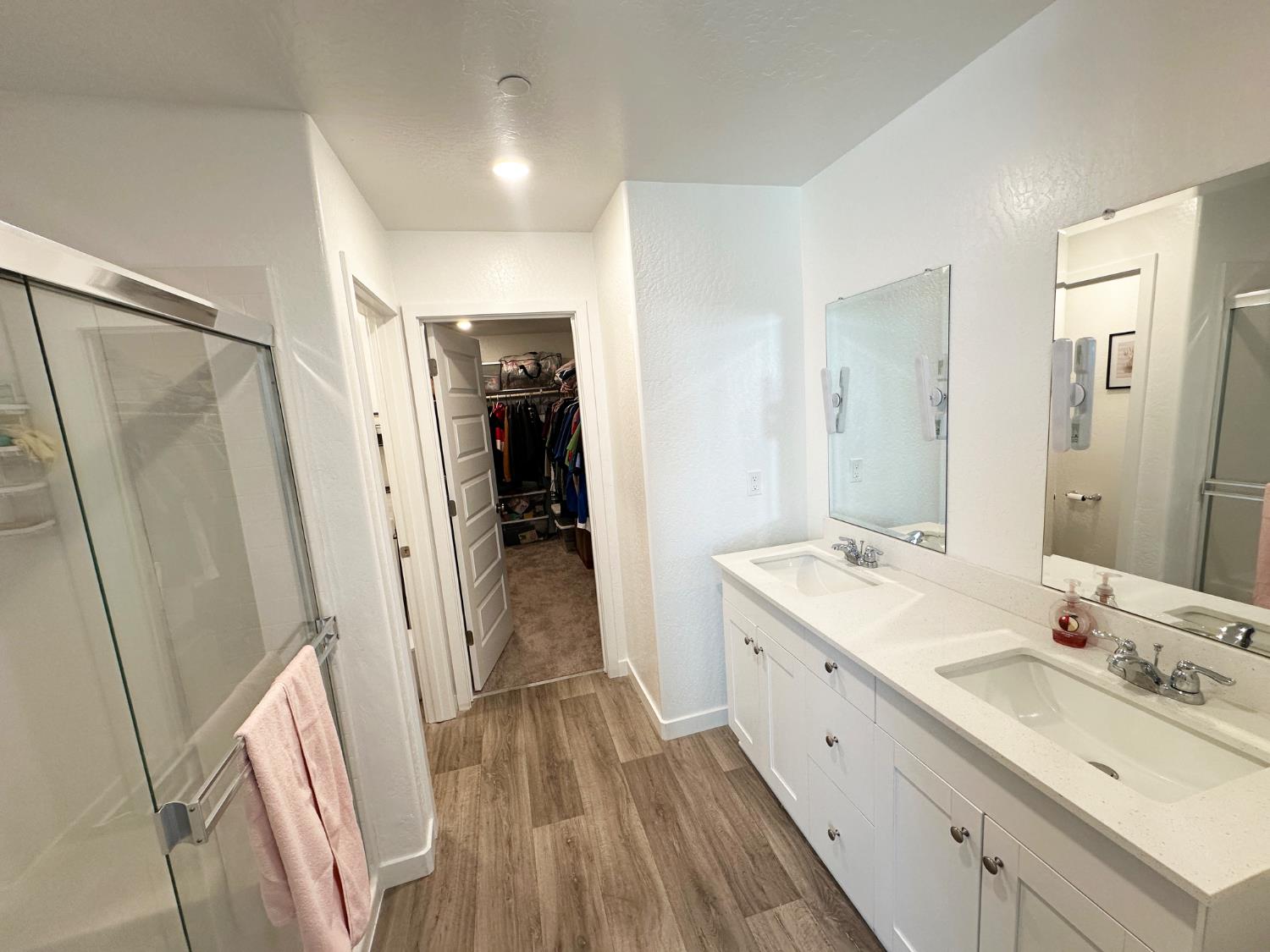 1757 Klamath Road South Madera, CA 93636 - Photo 33 of 34 a bathroom with a double vanity sink and mirror