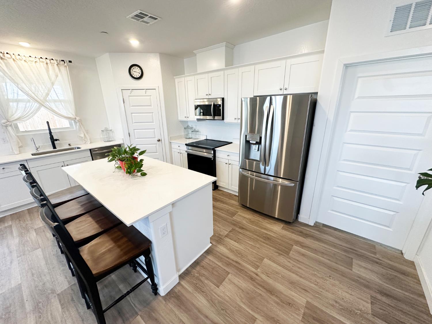 1757 Klamath Road South Madera, CA 93636 - Photo 8 of 33 a kitchen with a sink appliances and cabinets