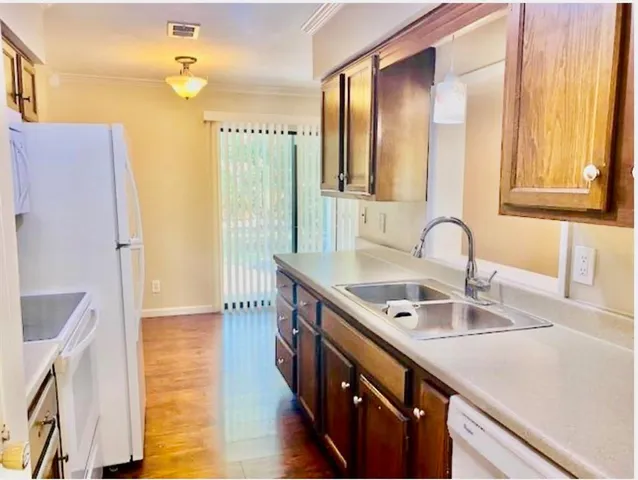 a bathroom with a sink double vanity and a mirror