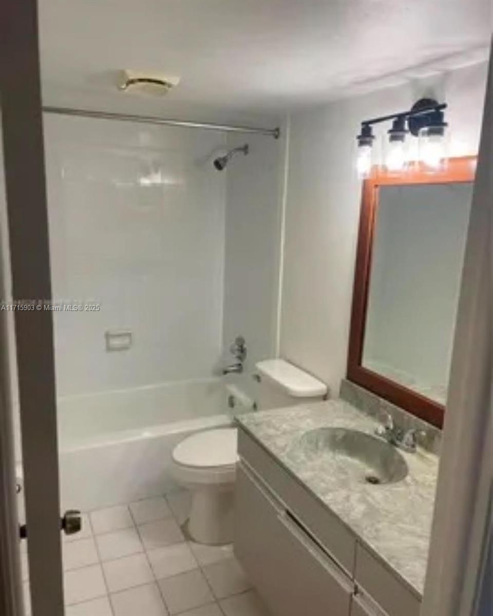 6700 Cypress Road, Unit 512 Plantation, FL 33317 - Photo 4 of 27 a bathroom with a granite countertop sink toilet and shower