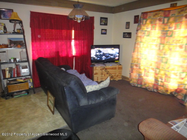 409 East 4th Street Rifle, CO 81650 - Photo 4 of 19 a living room with furniture and a window