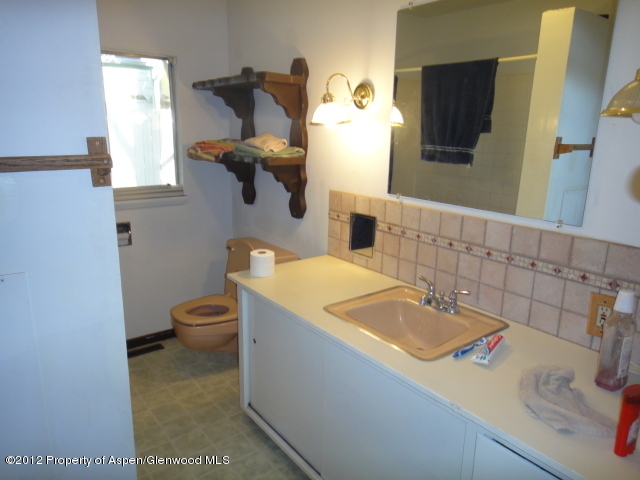 409 East 4th Street Rifle, CO 81650 - Photo 6 of 19 a bathroom with a sink and a toilet