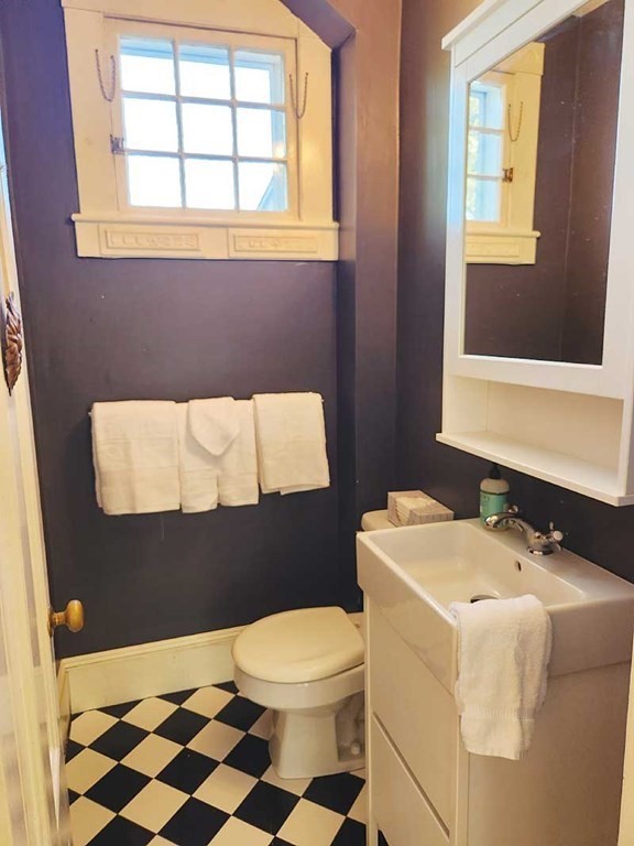 60 Maple Street Framingham, MA 01702 - Photo 11 of 24 a bathroom with a sink a toilet and a window