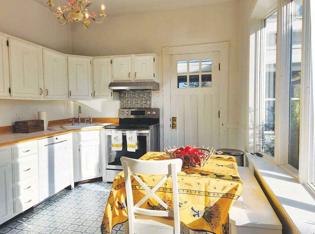 60 Maple Street Framingham, MA 01702 - Photo 12 of 24 a kitchen with a table and chairs
