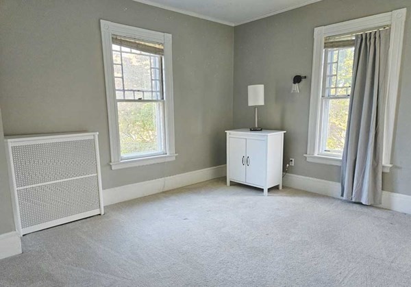 60 Maple Street Framingham, MA 01702 - Photo 17 of 24 an empty room with windows and cabinet