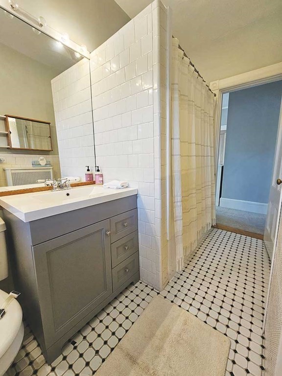 60 Maple Street Framingham, MA 01702 - Photo 19 of 24 a bathroom with a sink toilet and shower