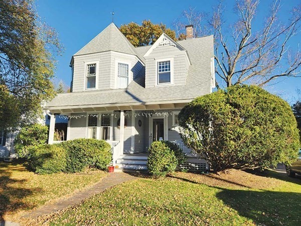 60 Maple Street Framingham, MA 01702 - Photo 2 of 24 a front view of a house with a yard
