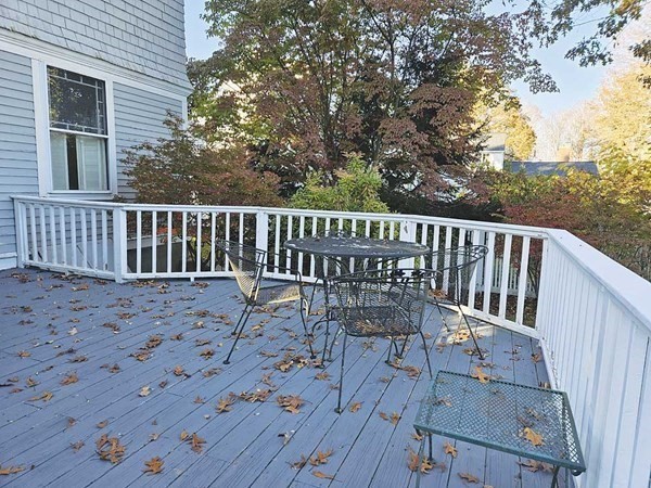 60 Maple Street Framingham, MA 01702 - Photo 22 of 24 a view of a chair and table on the wooden deck