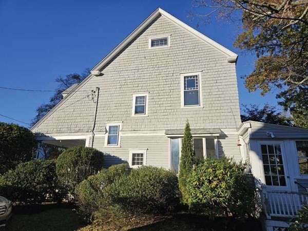 60 Maple Street Framingham, MA 01702 - Photo 23 of 24 a front view of a house with plants and entryway