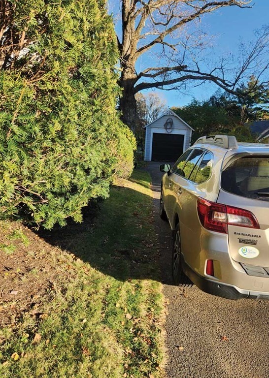 60 Maple Street Framingham, MA 01702 - Photo 24 of 24 a car parked in front of a yard
