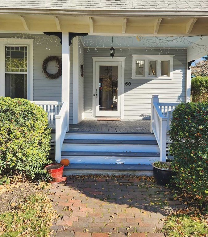 60 Maple Street Framingham, MA 01702 - Photo 3 of 24 a front view of a house with entryway