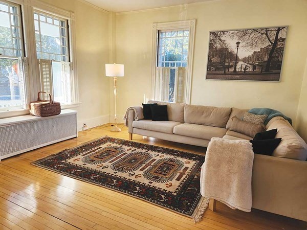 60 Maple Street Framingham, MA 01702 - Photo 7 of 24 a living room with furniture and a rug
