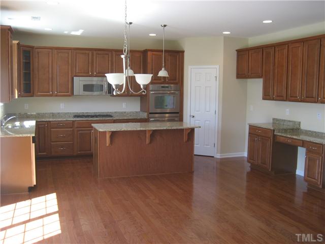 229 Forbes Road, Unit LOT62 Wake Forest, NC 27587 - Photo 12 of 12 2cd shot of kitchen.....great space and a desk station too! Stainless stell appliances!