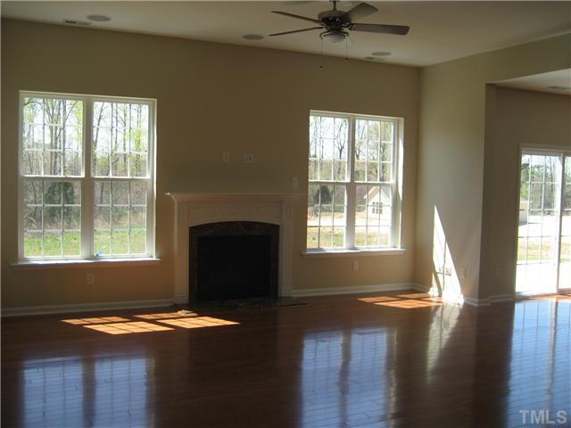 229 Forbes Road, Unit LOT62 Wake Forest, NC 27587 - Photo 3 of 12 Open family room with 10' ceilings and wood floors. Flush-mount surround sound speakers installed.
