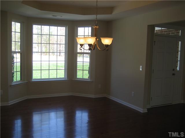 229 Forbes Road, Unit LOT62 Wake Forest, NC 27587 - Photo 4 of 12 Spacious dining room with tray ceiling, bay window and wood floors.