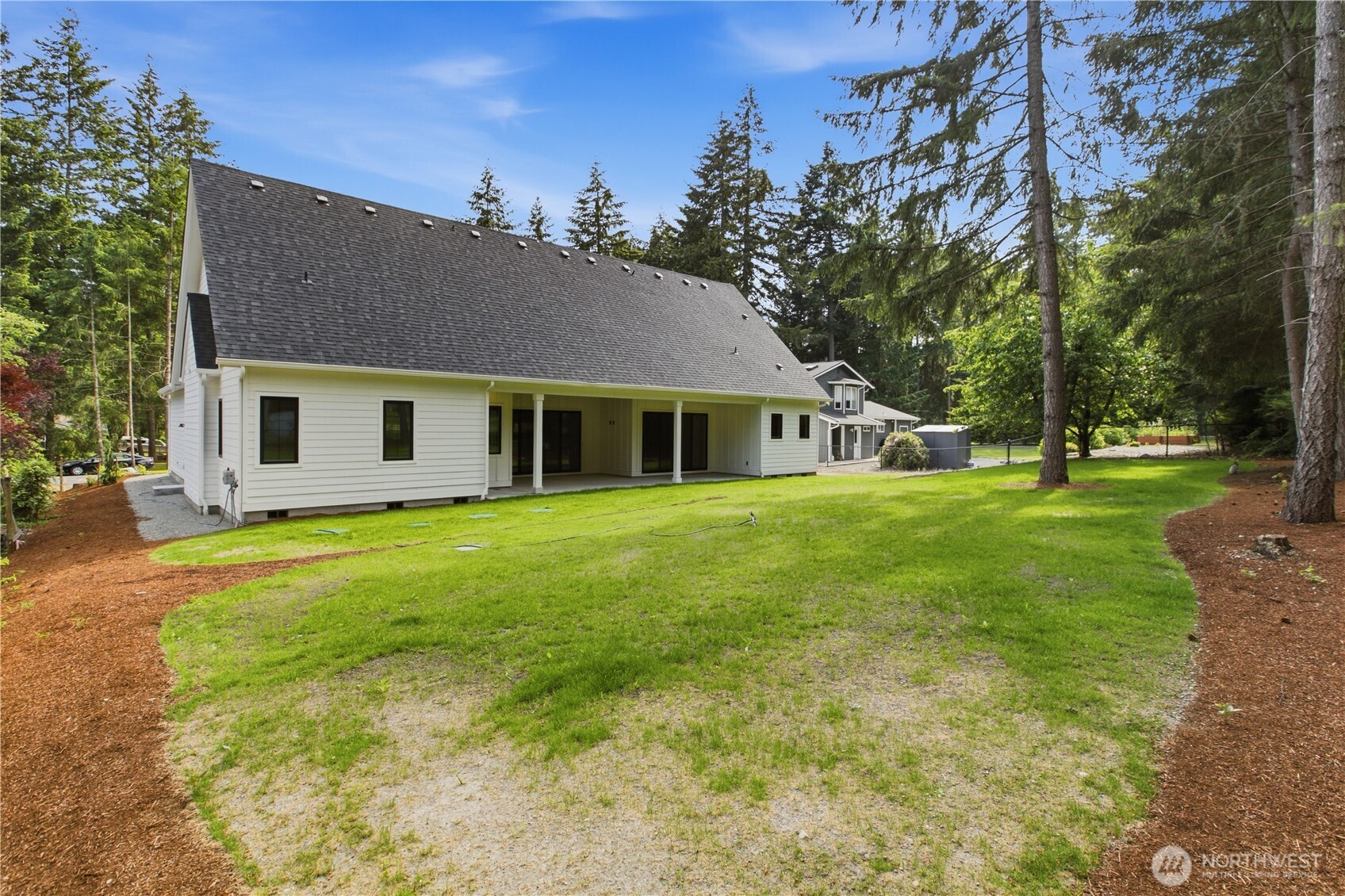 6709 254th Street East Graham, WA 98338 - Photo 36 of 40 a front view of house with yard and green space