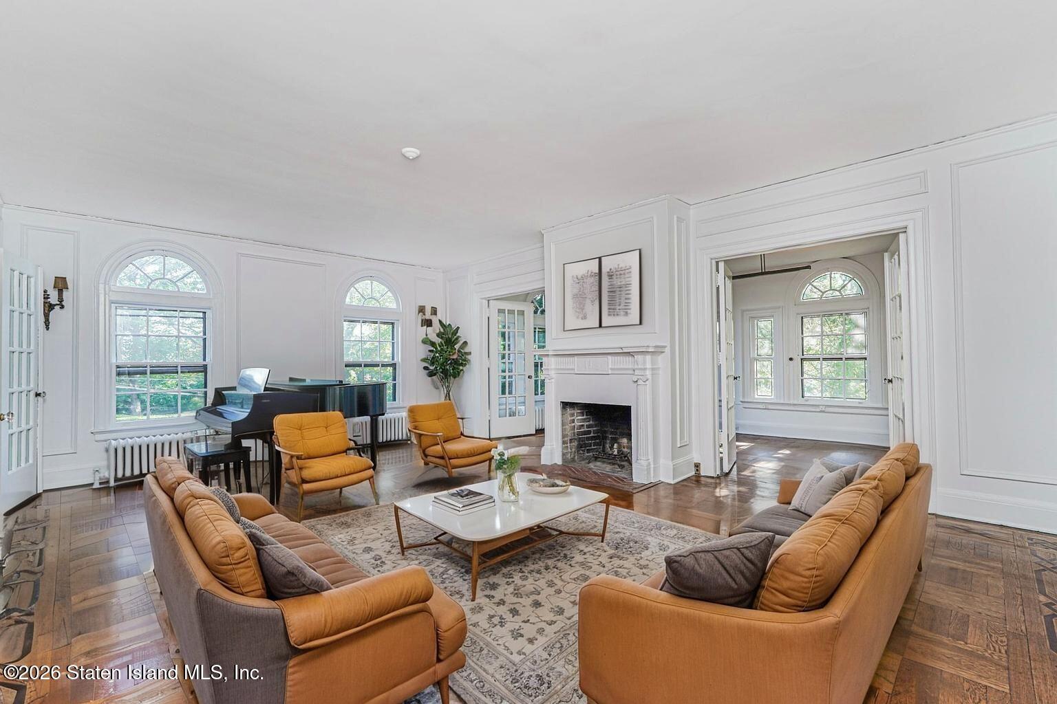 12 Silver Lake Road Staten Island, NY 10301 - Photo 13 of 33 a living room with furniture and a fireplace