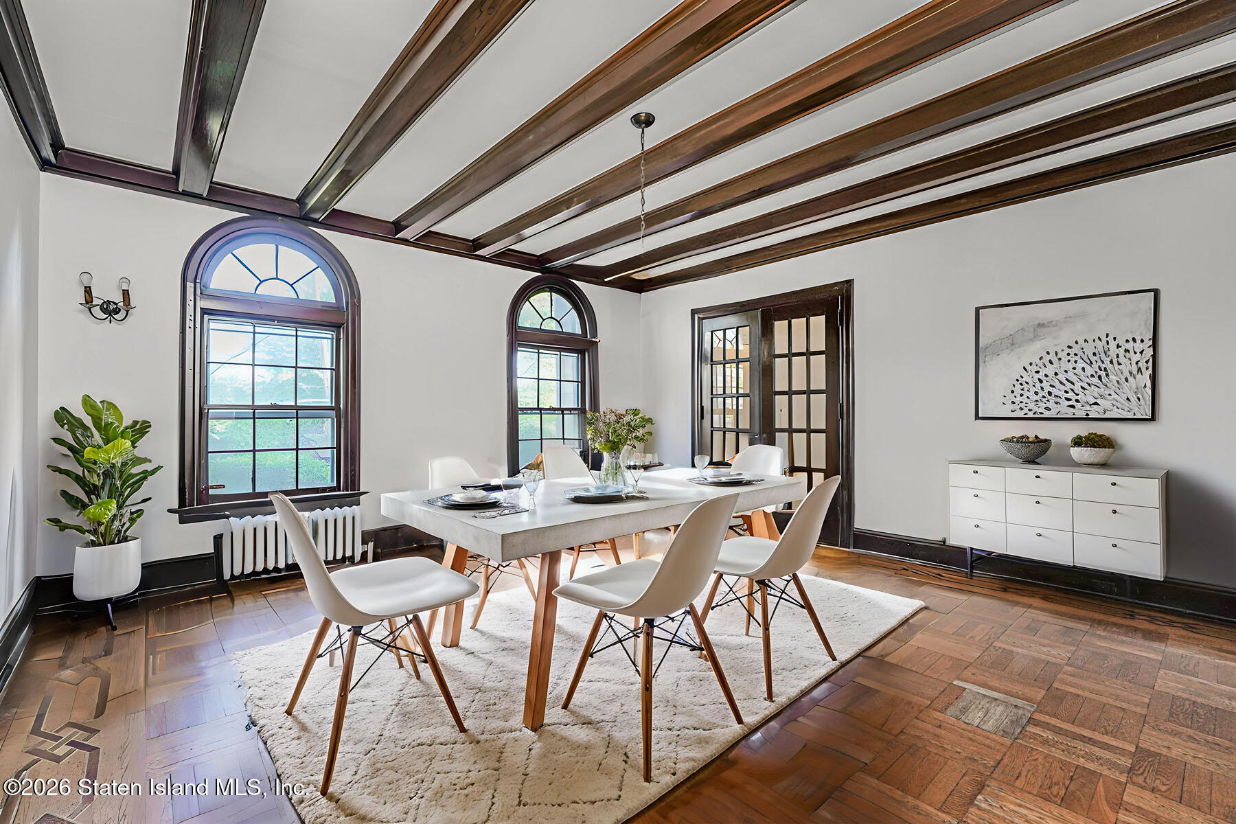 12 Silver Lake Road Staten Island, NY 10301 - Photo 17 of 33 a view of a dining room with furniture window and wooden floor