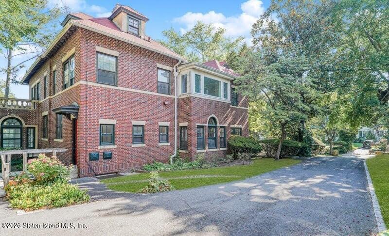 12 Silver Lake Road Staten Island, NY 10301 - Photo 22 of 33 a front view of a house with garden