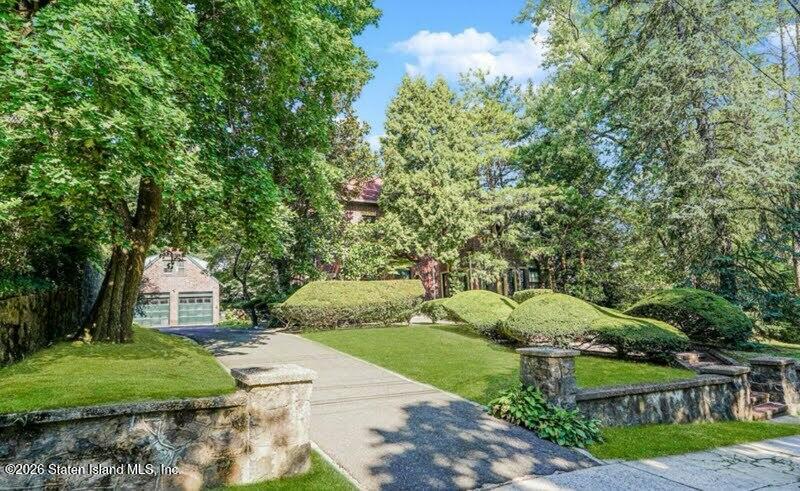 12 Silver Lake Road Staten Island, NY 10301 - Photo 24 of 33 a front view of a house with a yard and shrubs