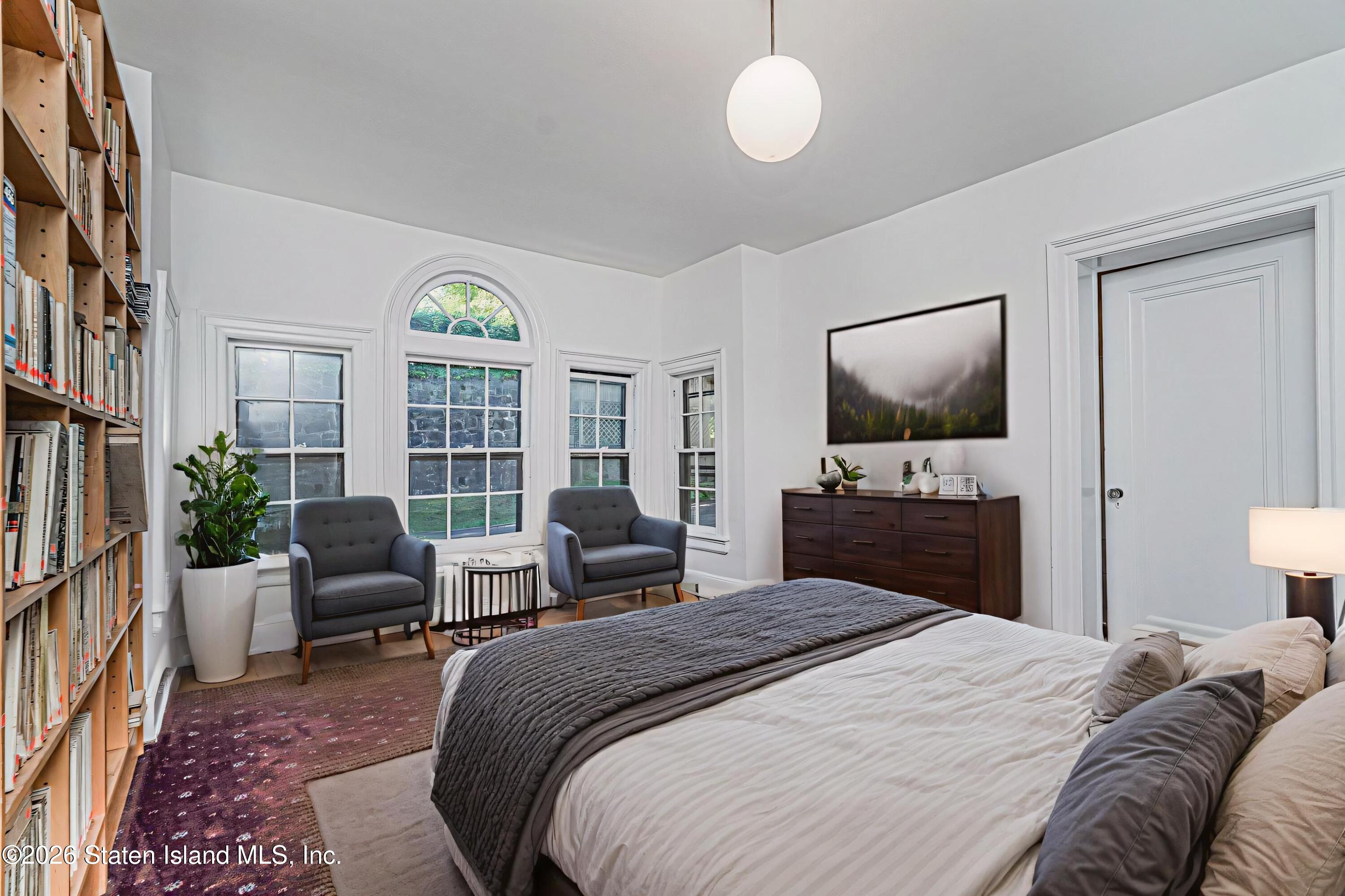 12 Silver Lake Road Staten Island, NY 10301 - Photo 10 of 33 a bedroom with a bed and a flat screen tv